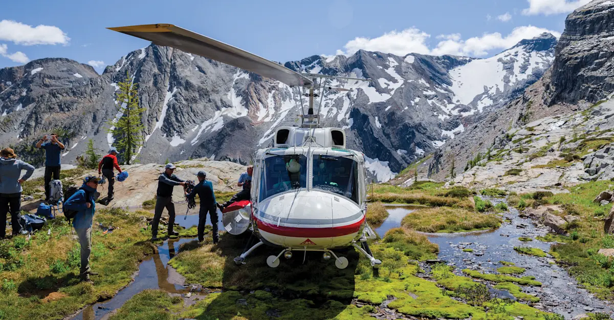 Guests heli-exploring, Columbia Mountains, British Columbia.