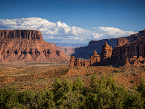 Red rock formations rise above the desert landscape near Moab, Utah.