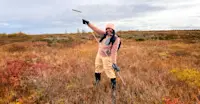 Earthwatch Expeditions guest taking measurements, Churchill, Manitoba, Canada.