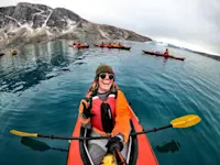 Going for a sea kayak right off the shore of our very own Base Camp in Greenland.