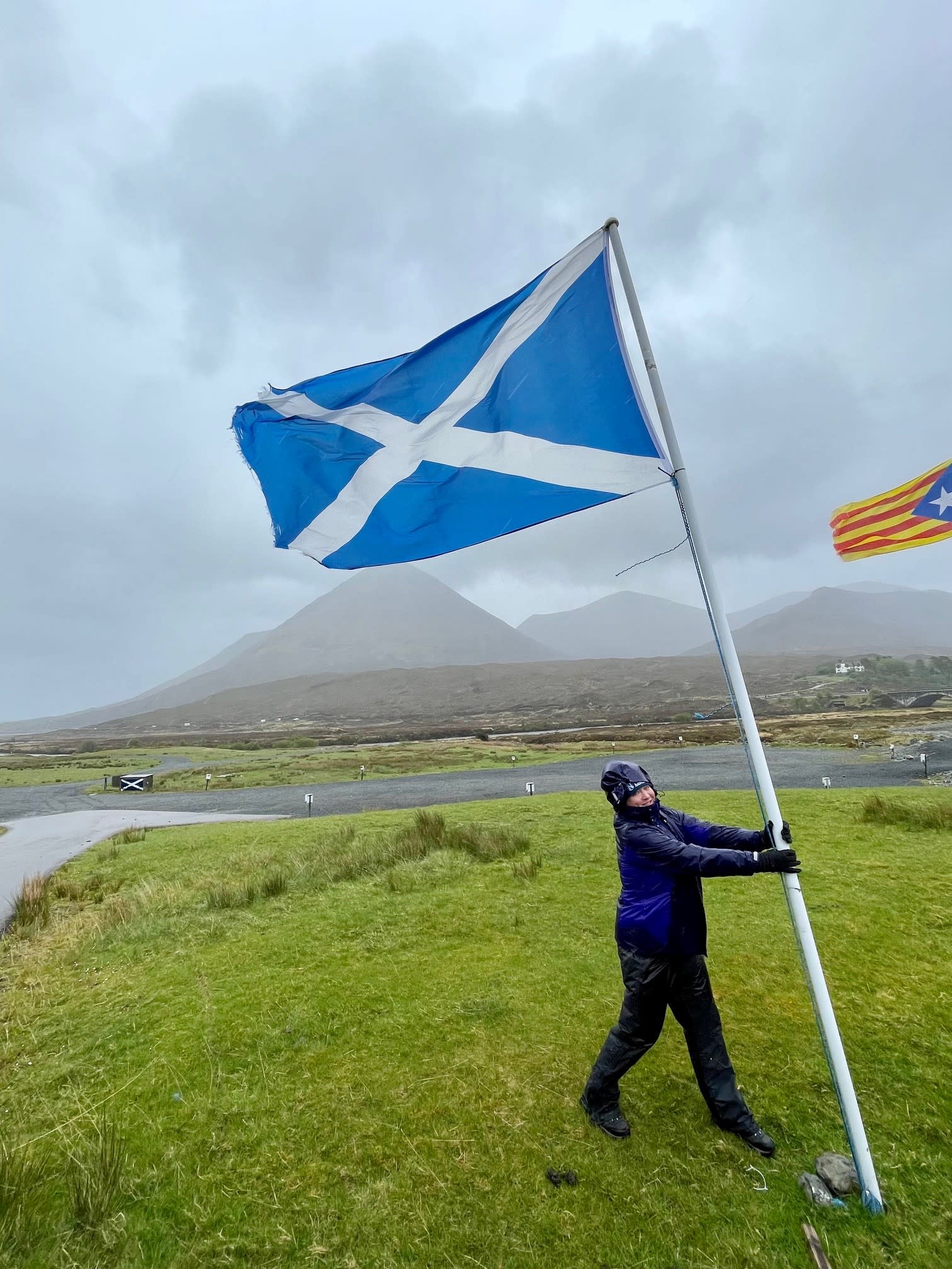 Enduring the infamous Scottish weather.