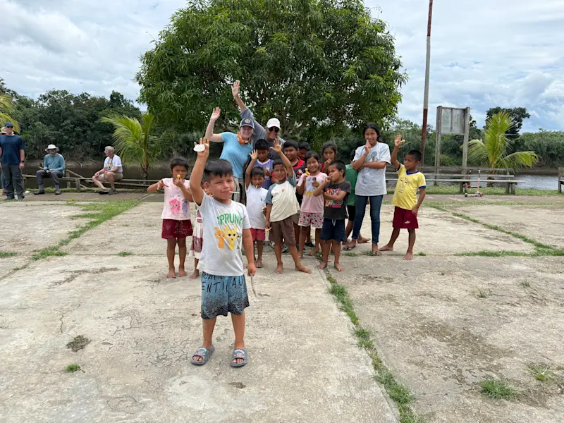  Isla and Tania with the local kiddos in Peru.