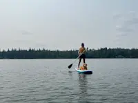 Paddle boarding with one of my dogs in Canada. 