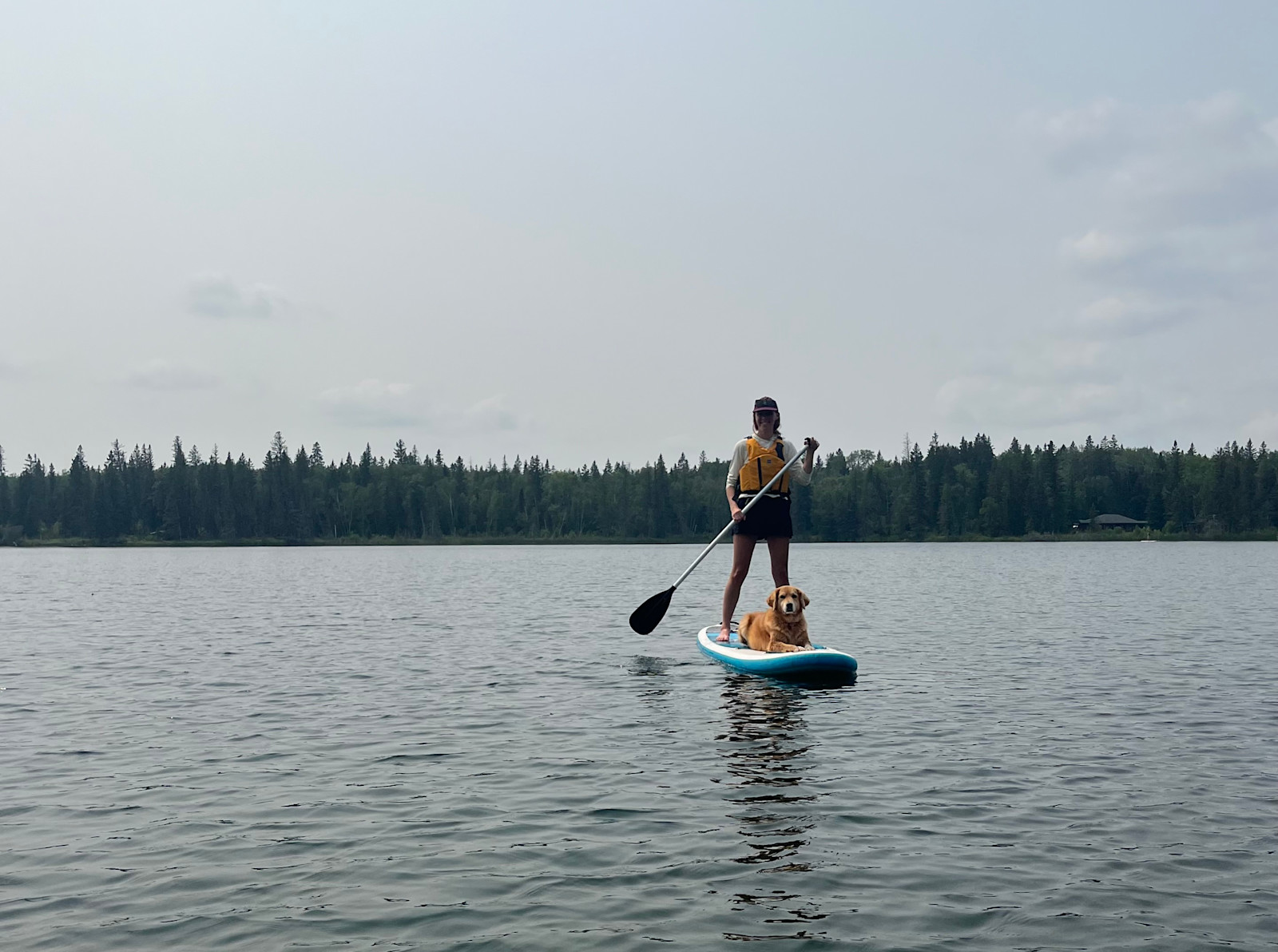 Paddle boarding with one of my dogs in Canada. 