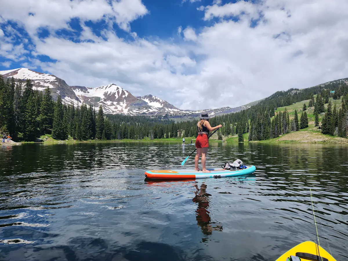 Gliding across the water by paddleboard in Crested Butte, Colorado.