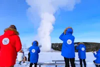 Nat Hab guests, Old Faithful geiser, Yellowstone National Park, Wyoming.