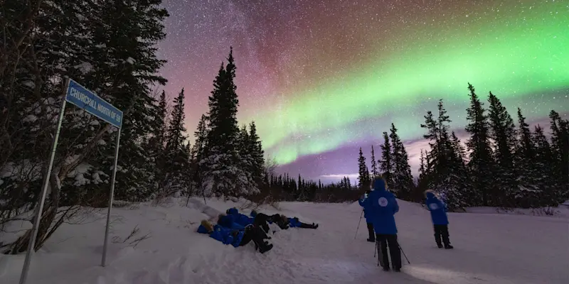 Nat Hab guests viewing northern lights, Churchill, Manitoba.