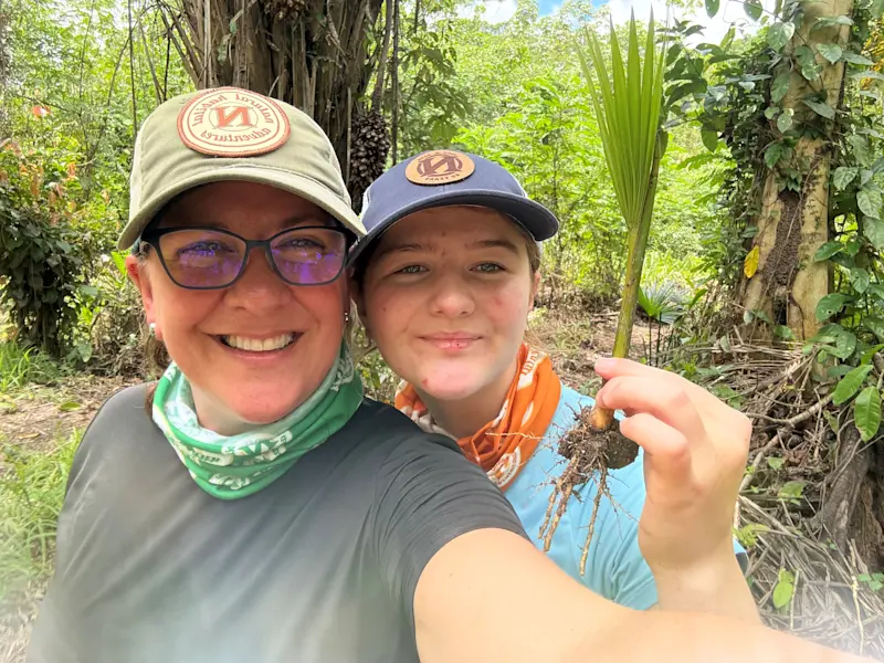Tree planting as part of a reforestation project in the Amazon, Peru.
