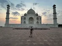 Standing before the ivory-white marble masterpiece at sunrise in Agra, India. 