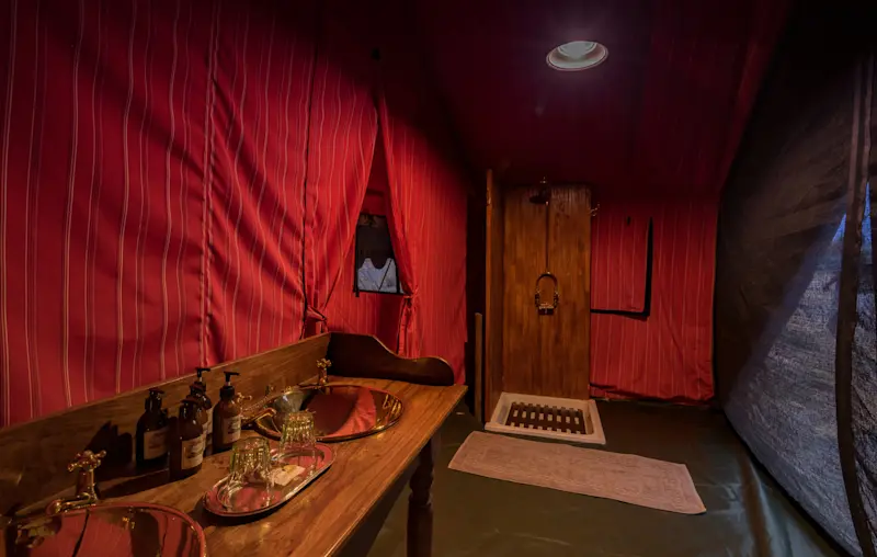 Guest tent interior at Nat Hab's Explorer Camp