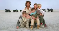 Family on quad bikes, Makgadikgadi pans, Botswana.