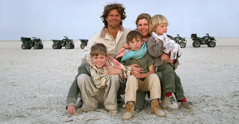 Family on quad bikes, Makgadikgadi pans, Botswana.