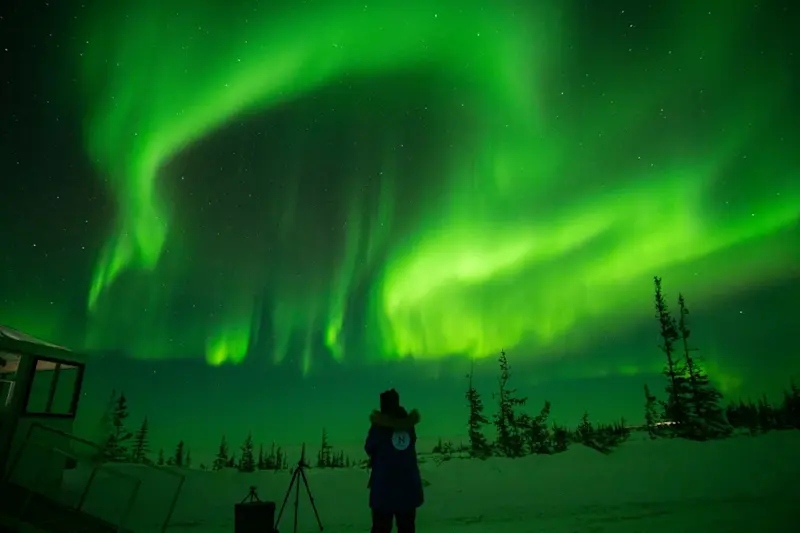 A place where the sky dances and the tundra glows. The Northern Lights in Churchill, Manitoba.