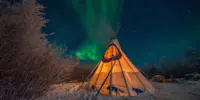 Northern lights above tepee, Churchill, Manitoba.