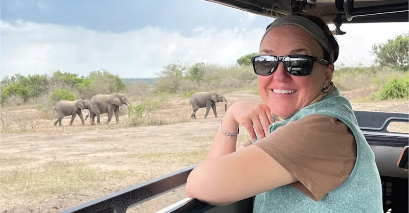 Nat Hab guest and elephants, Serengeti National Park, Tanzania. 