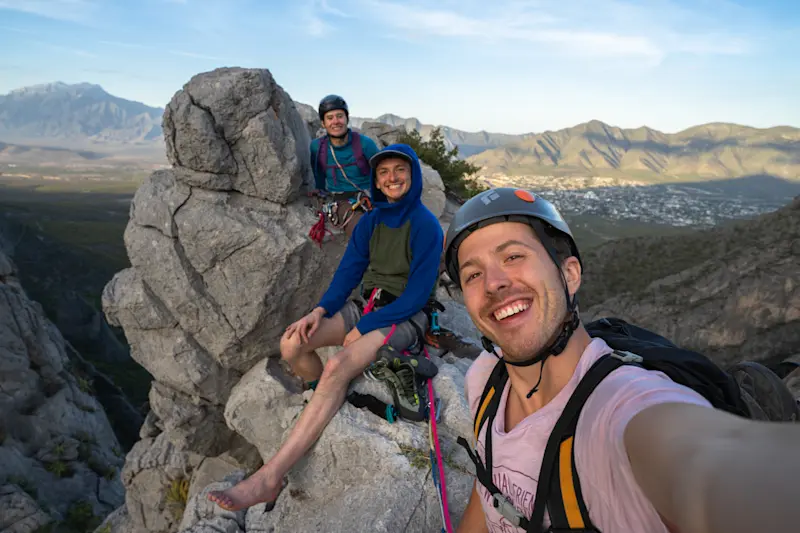 Celebrating the summit of a multi-pitch climb in El Potrero Chico, Mexico.