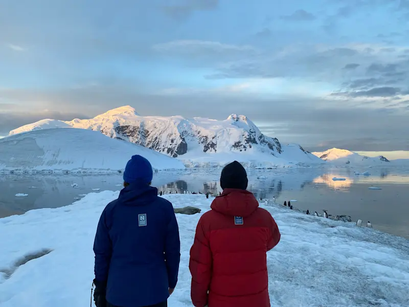 Viewing penguins with Expedition Leader Colby Brokvist in Antarctica. 