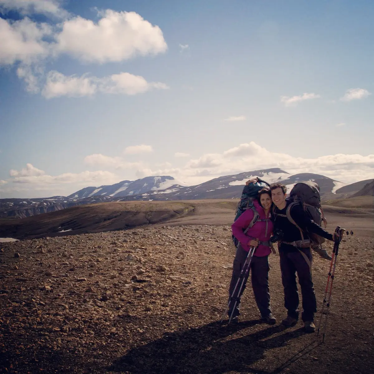Chasing waterfalls and quiet moments together across dramatic landscapes in Iceland.