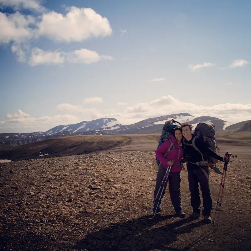 Chasing waterfalls and quiet moments together across dramatic landscapes in Iceland.