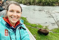 A selfie with the famous chunk in Brooks Falls, Alaska.
