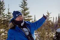 Adventuring across frozen tundra in search of snowy owls and gyrfalcons in Churchill, Manitoba.