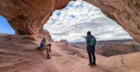 Nat Hab guests, Mesa Arch, Canyonlands National Park, Utah.