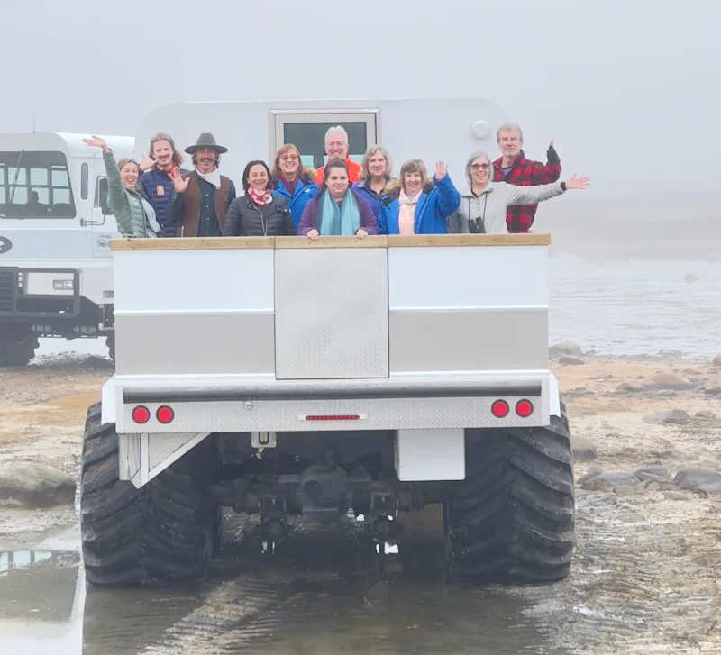 Nat Hab guests in Churchill, Manitoba, Canada, wave from the balcony of a Polar Rover by Megan Brief
