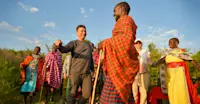 Earthwatch Expeditions guests meet Maasai Tribe members, Maasai Mara, Kenya.
