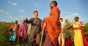 Earthwatch Expeditions guests meet Maasai Tribe members, Maasai Mara, Kenya.