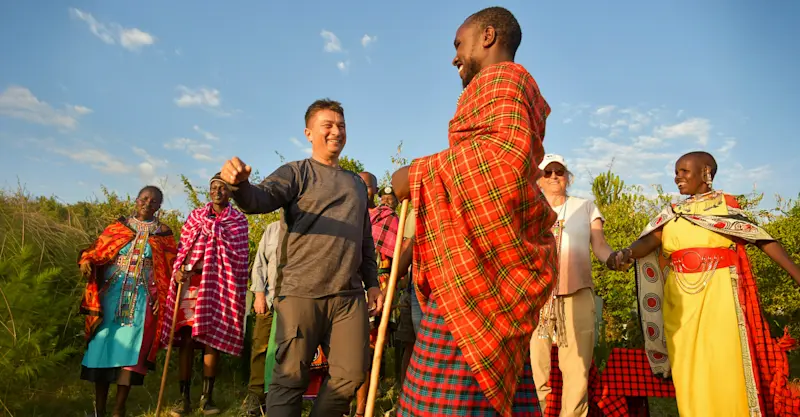 Earthwatch guests meet Maasai Tribe members, Maasai Mara, Kenya.