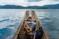 Canoeing around Lake Bunyoni, Uganda.