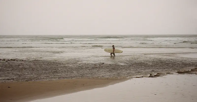 Surfing along the Oregon coast. 