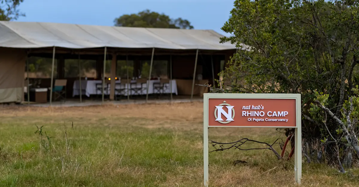 Camp sign and dining tent Nat Hab's Rhino Camp—Ol Pejeta Conservancy.