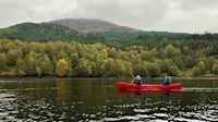 Nat Hab guests canoeing, Glen Affric Nature Reserve, Scotland.