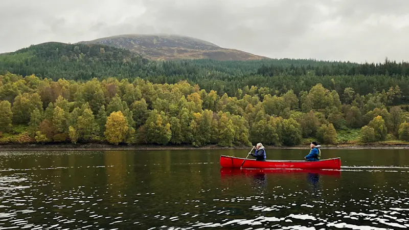 Nat Hab guests canoeing, Glen Affric Nature Reserve, Scotland.
