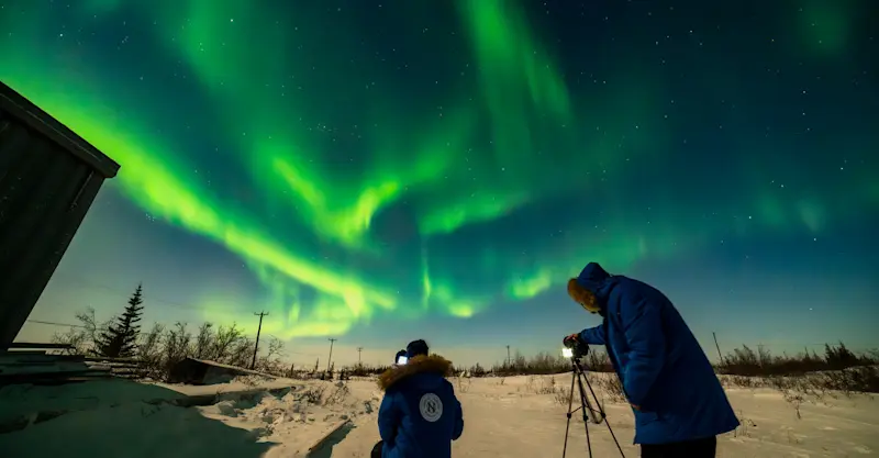 Nat Hab guests photographing northern lights, Churchill, Manitoba.