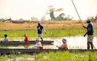 Nat Hab guests and guides on a mokoro safari, Okavango Delta, Botswana.