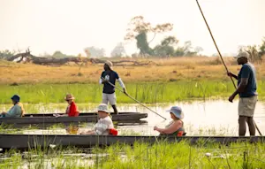Nat Hab guests and guides on a mokoro safari, Okavango Delta, Botswana.