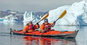 Nat Hab guests kayaking, Sermilik Fjord, Greenland.
