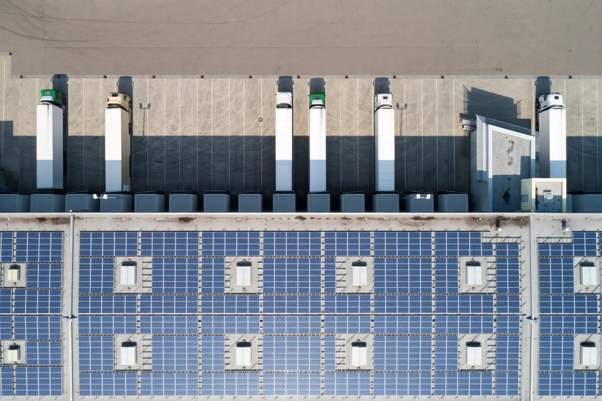 Aerial view of transport trucks in lot.