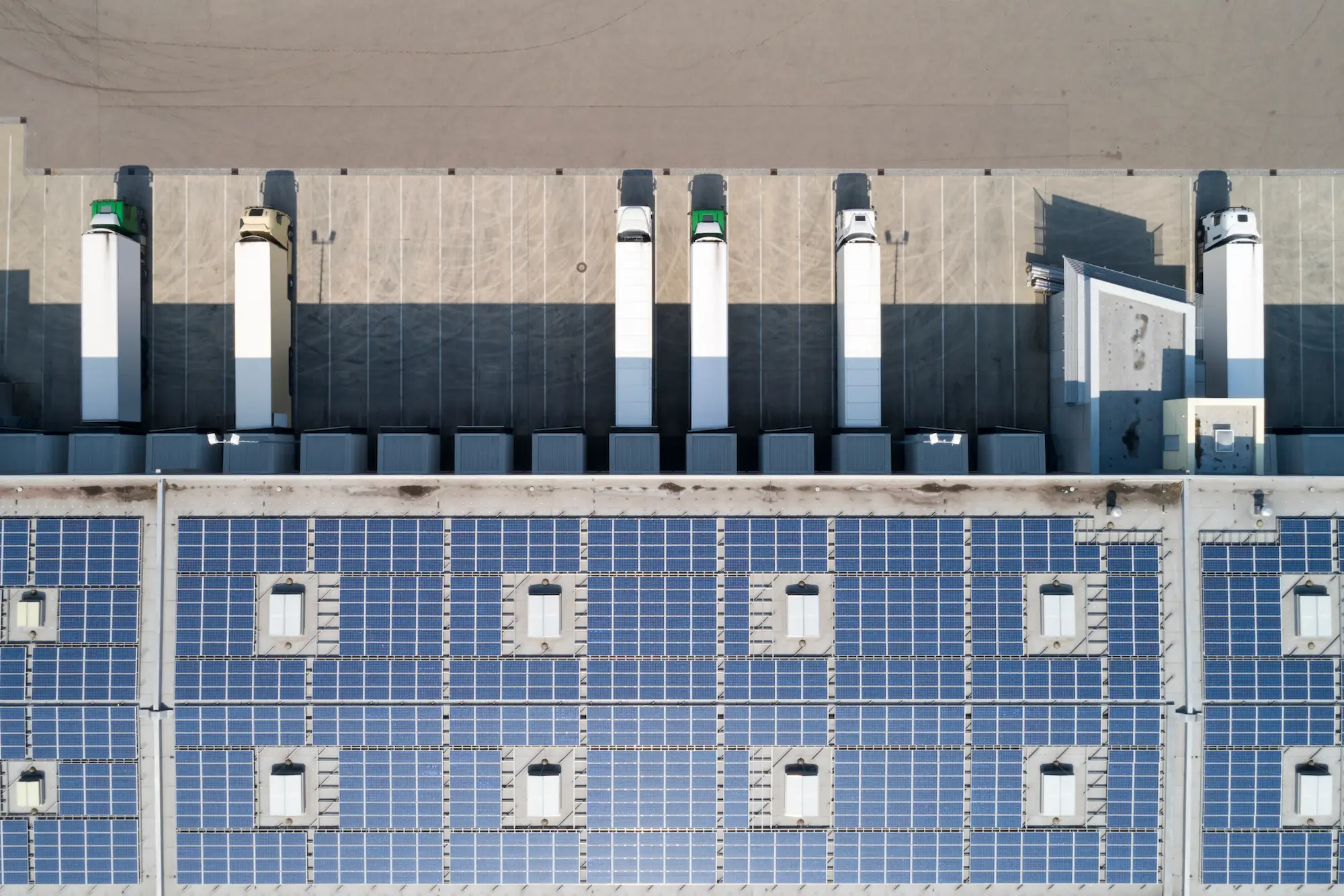 Aerial view of transport trucks in lot.