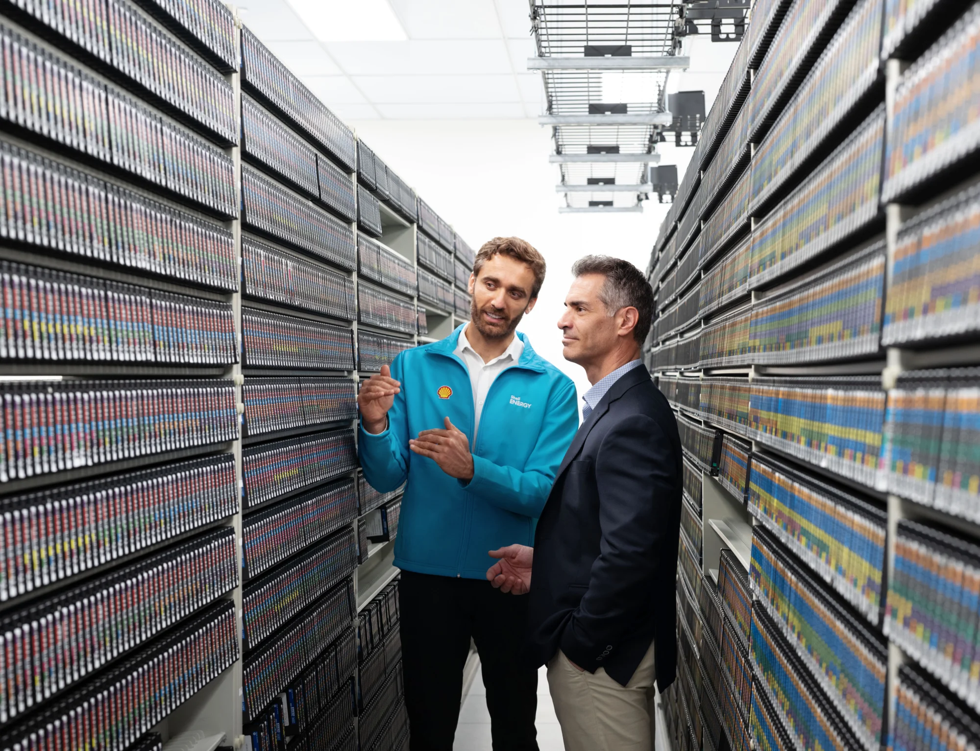 A Shell Energy expert discussing with a man at a facility.