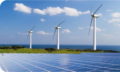 Three windmills and a field of solar panels