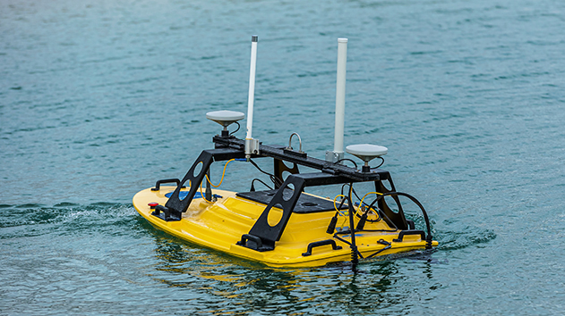 Unmanned survey boat with two pole antennas and two GNSS receivers