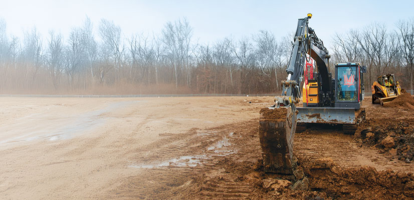 Siteworks Machine Guidance on an excavator and a compact track loader on a dirt construction site