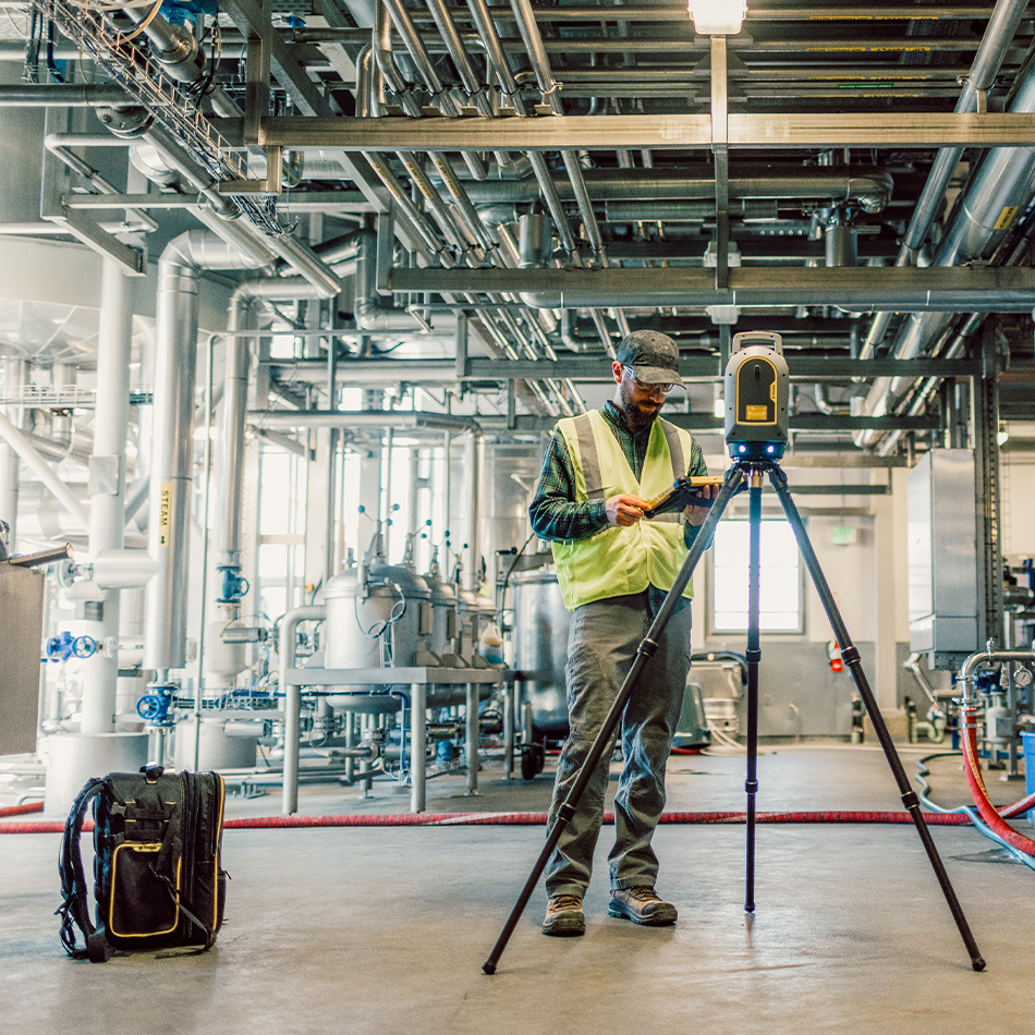 Trimble X9 3D laser scanner on a tripod inside a building