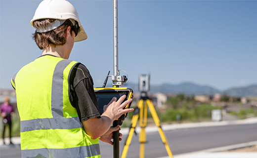 Surveyor collecting data on a T110 tablet with SX12 scanning total station