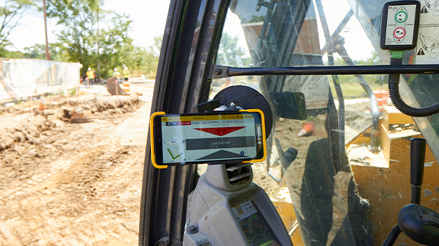 A Trimble display in cab monitoring material placement