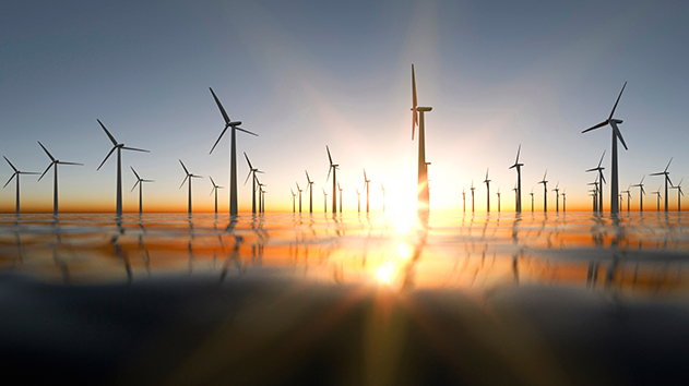 Large off-shore wind farm at sunset