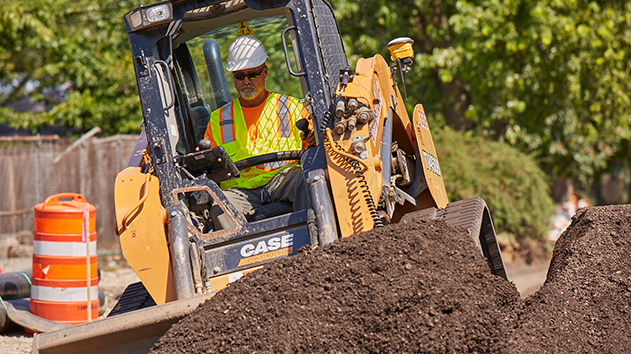 Compact machine moving dirt using Siteworks Machine Guidance technology